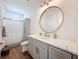Well-lit bathroom featuring a marble countertop, gold fixtures, and modern design at 464 Long & Winding Rd, Groveland, FL 34736
