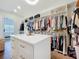 Organized walk-in closet with custom built-ins, drawers, and ample hanging space at 464 Long & Winding Rd, Groveland, FL 34736