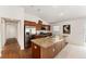 Kitchen featuring stainless steel appliances, large island and view to the hallway at 5675 Herman Ave, The Villages, FL 32163