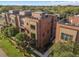 Aerial view of townhomes highlighting rooftop terraces and lush landscaping at 60 N Park Ave, Winter Garden, FL 34787