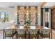 Dining room with long table, chandelier and exterior view at 60 N Park Ave, Winter Garden, FL 34787