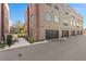 Modern townhome exterior with attached garages and well-maintained landscaping at 60 N Park Ave, Winter Garden, FL 34787