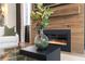 Close up of fireplace, mantel with TV and modern decor at 60 N Park Ave, Winter Garden, FL 34787