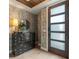 Foyer with wallpaper, wood flooring, and decorative chest at 60 N Park Ave, Winter Garden, FL 34787