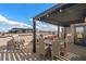 Relaxing rooftop terrace featuring dining area with pergola and outdoor grill at 60 N Park Ave, Winter Garden, FL 34787