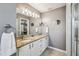 Bathroom featuring double sinks, granite countertop and vanity at 750 Evelynton Loop, The Villages, FL 32162