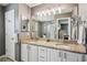 Bathroom featuring double sinks, granite countertop and vanity at 750 Evelynton Loop, The Villages, FL 32162