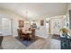 Bright dining room adjacent to the kitchen with modern wood-look flooring at 750 Evelynton Loop, The Villages, FL 32162