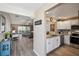 Open-concept kitchen featuring granite countertops and stainless steel appliances at 750 Evelynton Loop, The Villages, FL 32162