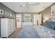 Spacious bedroom featuring a ceiling fan, neutral decor, and an ensuite bathroom at 750 Evelynton Loop, The Villages, FL 32162