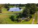 Breathtaking aerial view of the Country Club of Mount Dora with golf course and water feature at 8051 Saint James Way, Mount Dora, FL 32757