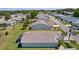 Aerial view of the house showcasing its neat landscaping and an enclosed back patio at 841 Eagles Lndg, Leesburg, FL 34748