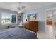 Bedroom with a tile floor, ceiling fan, window, and dresser with decor and a TV at 841 Eagles Lndg, Leesburg, FL 34748