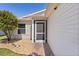 Welcoming front porch with a screen door, complemented by mature landscaping and neutral siding at 841 Eagles Lndg, Leesburg, FL 34748