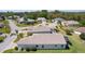 Aerial view showcasing the home's rear exterior, with a screened in porch and landscaped yard at 841 Eagles Lndg, Leesburg, FL 34748