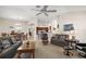 Spacious living room seamlessly connecting to the dining area and kitchen at 859 Parksville Path, The Villages, FL 32162