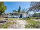 View of the house backyard, including patio and fire pit at 102 S Sunland Dr, Sanford, FL 32773