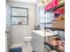 Well-lit bathroom with modern sink and vanity, and a patterned glass window at 102 S Sunland Dr, Sanford, FL 32773