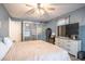 Comfortable bedroom with lots of closet space, hardwood floors, and a cozy queen sized bed at 102 S Sunland Dr, Sanford, FL 32773