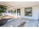 Close up of the front porch and entry door with well kept painted brick at 102 S Sunland Dr, Sanford, FL 32773