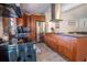 Kitchen features hardwood floors, stainless steel appliances, and modern island with dark countertops at 102 S Sunland Dr, Sanford, FL 32773