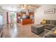 Spacious living room and dining area featuring natural light and modern flooring at 102 S Sunland Dr, Sanford, FL 32773