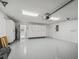 Spacious garage with epoxy flooring and plenty of storage at 11743 Se 174Th Loop, Summerfield, FL 34491
