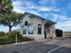 Welcoming guard house entrance featuring a classic design with decorative windows and festive wreaths at 11743 Se 174Th Loop, Summerfield, FL 34491