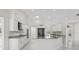 Modern kitchen featuring granite countertops, stainless steel appliances, and ample white cabinetry at 11743 Se 174Th Loop, Summerfield, FL 34491