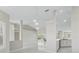 Bright living room features tile flooring, pendant lights, and a view of the outdoors at 11743 Se 174Th Loop, Summerfield, FL 34491
