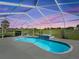 Relax in this screened-in pool with spa overlooking the golf course for serene outdoor enjoyment at 11743 Se 174Th Loop, Summerfield, FL 34491