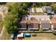 Overhead shot of the home with mature trees and surrounding neighborhood at 1306 Vine St, Leesburg, FL 34748