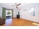 Bright bedroom with wood floors and sliding glass doors that lead to the patio at 1306 Vine St, Leesburg, FL 34748