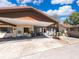 Exterior day shot showing the car port and front facade of the home at 1306 Vine St, Leesburg, FL 34748