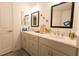 Modern bathroom with double sinks, quartz countertops, and decorative turtle accents at 1435 Jeremy Cir, The Villages, FL 34762