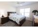 Cozy bedroom with a large window and a comfortable bed with decorative pillows at 1435 Jeremy Cir, The Villages, FL 34762