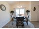 Bright dining area with sliding door and a stylish round table at 1435 Jeremy Cir, The Villages, FL 34762