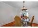 Elegant dining room with hardwood floors and an decorative light fixture at 1515 Washington Ave, Eustis, FL 32726