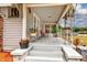 Spacious front porch with ample seating and decorative plants, perfect for relaxing outdoors at 1515 Washington Ave, Eustis, FL 32726