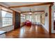 Inviting living room with wood floors, exposed ceiling beams, ample natural light, and comfortable seating at 1515 Washington Ave, Eustis, FL 32726