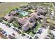 Aerial view of the community clubhouse and recreation area, featuring resort-style amenities and facilities at 155 Crepe Myrtle Dr, Groveland, FL 34736