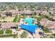 Aerial shot of the community pool and clubhouse, showcasing the inviting atmosphere and amenities at 155 Crepe Myrtle Dr, Groveland, FL 34736