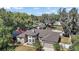 Aerial front elevation showcasing home's architectural details and well-manicured landscaping at 15803 Fairview Pt, Tavares, FL 32778