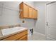 Functional laundry room with plenty of storage and workspace at 15803 Fairview Pt, Tavares, FL 32778