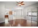 Expansive open-concept room with tile and hardwood, flowing into the kitchen and patio at 15803 Fairview Pt, Tavares, FL 32778