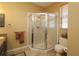 Bathroom featuring a glass corner shower, tile flooring, and comfort height toilet at 1721 Carrera Dr, The Villages, FL 32159