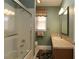 Mint bathroom featuring a shower and tub, window, and dark wood cabinets at 1721 Carrera Dr, The Villages, FL 32159