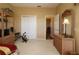 Bedroom is equipped with a dresser, exercise bike and closet at 1721 Carrera Dr, The Villages, FL 32159