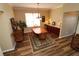 Charming dining area with natural light, hardwood floors, and buffet cabinet at 1721 Carrera Dr, The Villages, FL 32159