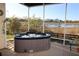 Relax in this screened-in hot tub and enjoy the lake views at 1721 Carrera Dr, The Villages, FL 32159